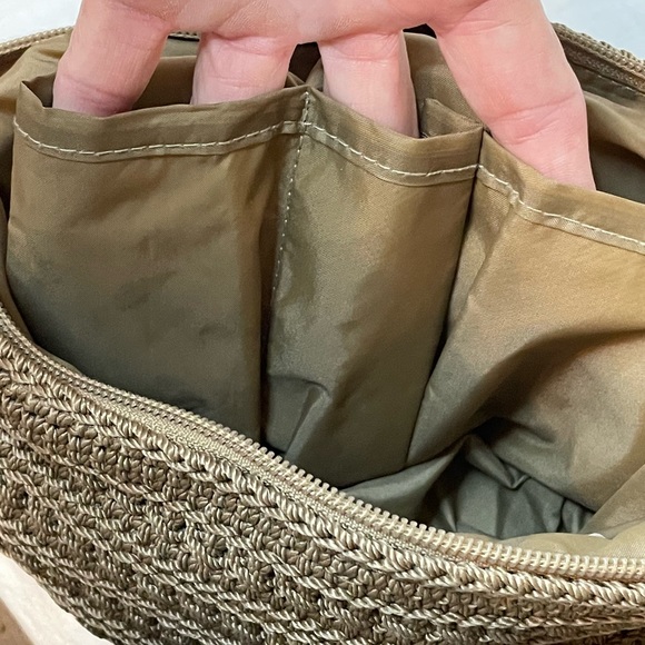 The Sak Crochet Shoulder Bag in Cognac color. Crochet Flower detail on zipper. - Picture 9 of 10